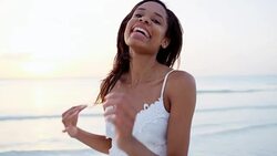 Portrait of ethnic girl taking selfie on beach Stock Footage
