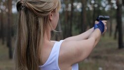The girl shoots from an air gun Stock Footage