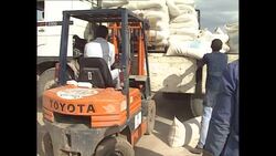 Aid being unloaded from trucks in the airport perimeter News Clip