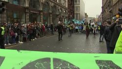 Climate change protesters marching through Glasgow News Clip