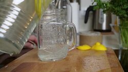 Young woman pouring lemonade Stock Footage