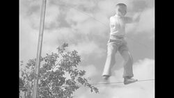 Boy named Harold Barnes performing stunts on tightrope in Miami News Clip