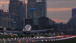 London City Airport with Canary Wharf in the distance Stock Footage