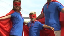 Superheroes family looking at camera and turning back, ready to face challenge Stock Footage