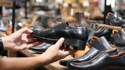man shopping on shoes in a shop Stock Footage