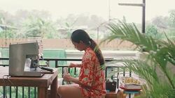 Young woman using coffee grinder at home. Stock Footage