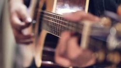 Acoustic guitar in musician hands at party. Stock Footage