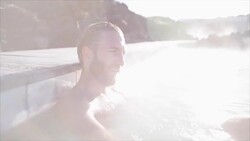 Geothermal spa. Man relaxing in hot spring pool in Iceland. Male enjoying bathing in a blue water lagoon Icelandic tourist attraction Stock Footage