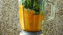 Cocktail from carrots, a stalk of a apium and spinacia. Process of preparation of cocktail. Stock Footage