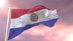 Flag of Paraguay waving at wind at sunset in slow, loop Stock Footage