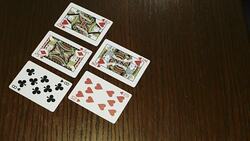 hands holding shuffle playing card deck on wooden table Stock Footage