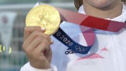 Beth Shriever posing with gold medal News Clip