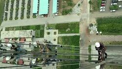 Top view of professional workers washing and cleaning window of building. Stock Footage