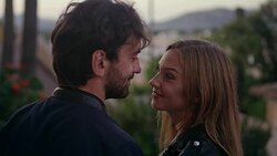 Happy couple on vacations. Old town panorama in background Stock Footage