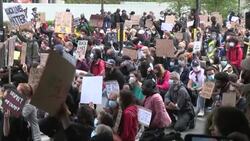 CLEAN : Anti-racism protesters take a knee in front of London's US embassy News Clip