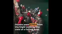 Fishing crew rescues migrants from a sinking boat. News Clip