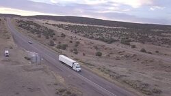 Aerial Drone Footage of Semi-Trucks Rolling Down the Highway Stock Footage