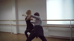Man and a woman are dancing in the studio Stock Footage
