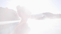 Geothermal spa. Woman relaxing in hot spring pool in Iceland. Girl enjoying bathing in a blue water lagoon Icelandic tourist attraction. 4K Stock Footage