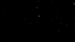 fire sparks from campfire with ash rise over black background, danger explosion Stock Footage