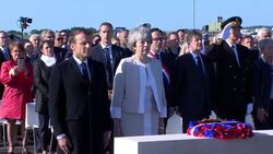 Theresa May and Emmanuel Macron laying wreath at British D-Day memorial News Clip