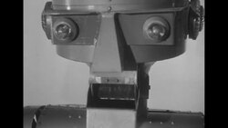 Inventor Harvey Chapman gives demonstration of robot Garco; with chemicals, at lathe, with actress Joanne Gilbert News Clip