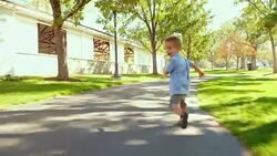 Little Boy Playing in a Park Stock Footage
