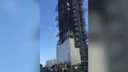 Extinction Rebellion protester unfurls flag off Big Ben News Clip