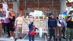 CLEAN : Activists shave their head outside New York Times building over Mahsa Amini death News Clip