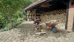Man splitting logs for firewood Stock Footage
