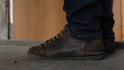 Man enters the door of a close-up Stock Footage