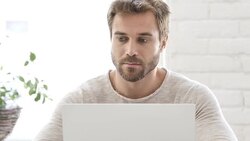 Busy Man Tying On Laptop at Work Stock Footage