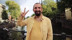 Portrait of Happy Man making victory sign, Outdoor Stock Footage