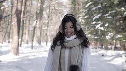 Portrait of cheerful woman walking in winter Stock Footage