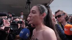 Half-naked activist stages protest at candidate Zelensky's polling station News Clip
