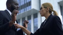 Woman blaming afro-american employee in startup failure, racial discrimination Stock Footage