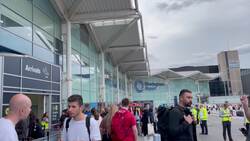 People wait outside Birmingham Airport after a disruption caused by an emergency landing News Clip