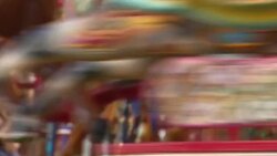 People on merry go round News Clip