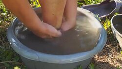 Woman washes her feet in the basin Stock Footage