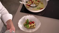 4k close up grating nutmeg over gnocchi in kitchen Stock Footage