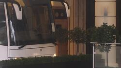 Coach carrying foreign arrivals disembarks at quarantine hotel News Clip