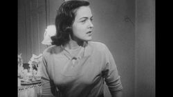 1950s: Wife looks at closed door Stock Footage