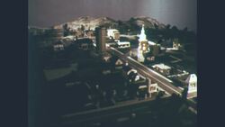 1960s: More areas of model town are lit up one by one Stock Footage