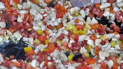 Man cooking meat with vegetables. Frying rice in a pan. Stock Footage