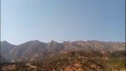 CLEAN : Smoke billows over Iraq mountain following deadly shelling blamed on Turkey News Clip