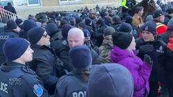 Police on foot and horseback push back fish harvesters at Confederation Building News Clip