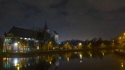 Illumination on a historic building. Historic Landmark. Time lapse. Cathedral of Kant in Kaliningrad. Old medieval at night against the sky. Timelapse. City park with a river, a pond. Stock Footage
