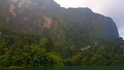 view of landscape limestone mountain rang and green forest with water lake Stock Footage