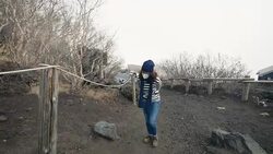 Young female tourist admiring Mt.Fuji's mossy landscape Stock Footage