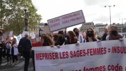 CLEAN : Midwives angry with 'lack of recognition' for work rally in Paris News Clip
